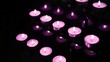 Pink candles at alter blowing out