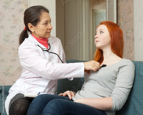 Photo: doctor listening the patient with stethoscope doctor listening the patient with stethoscope