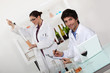 female and male wine laboratory technicians