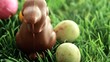 Easter eggs dropping in the grass with easter bunny