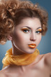 Beautiful woman with bright creative yellow makeup