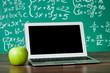 Laptop and apple on the desk