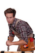 Carpenter with a chisel
