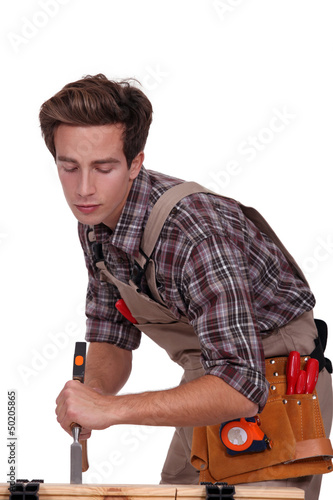 Photo: Carpenter with a chisel Carpenter with a chisel