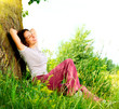 Beautiful Young Woman Relaxing outdoors. Nature