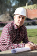 Engineer on site with plans