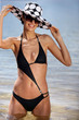 sexy brunette in black bikini with assorted sun hat