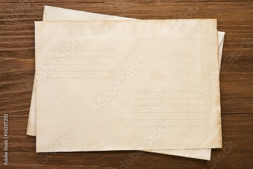 Photo: old postal envelope on wood old postal envelope on wood