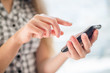 A woman uses a mobile phone