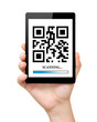 man hand hold a mini tablet with qr code on the screen