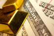 Close-up of a 20 dollar banknote note and gold bullions