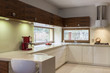 White kitchen with wooden furniture