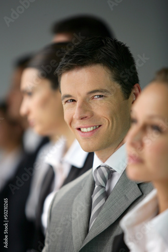 Photo: Businesspeople stood in a row Businesspeople stood in a row