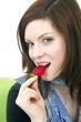 young beautiful woman with a strawberry