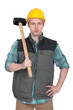 Builder stood with sledge-hammer