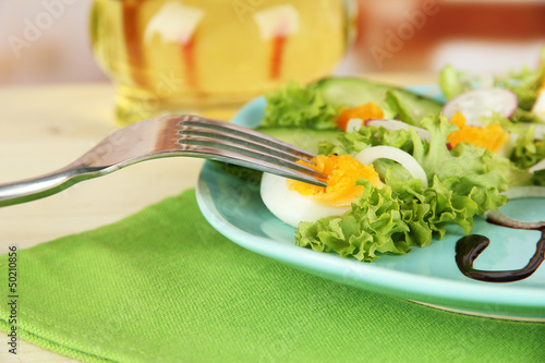 Photo: Fresh mixed salad with eggs, salad leaves and other vegetables Fresh mixed salad with eggs, salad leaves and other vegetables