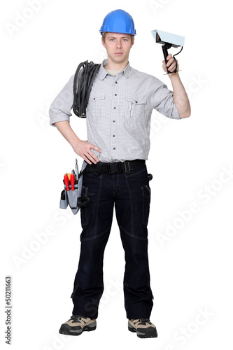 Photo: Electrician installing CCTV system Electrician installing CCTV system