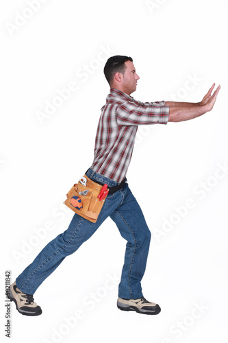Photo: craftsman pushing something craftsman pushing something