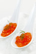 Caviar in spoons on ice