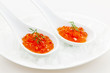 Caviar in spoons on ice