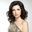 Beautiful sexy woman with broun curly hairs