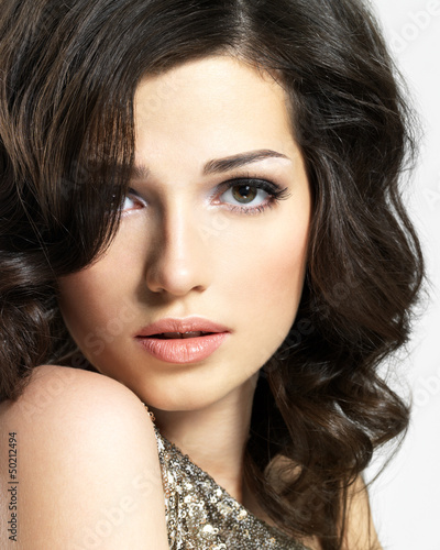 Photo: Beautiful sexy woman with broun curly hairs Beautiful sexy woman with broun curly hairs