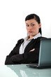 bored businesswoman looking at her laptop