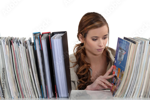 Photo: female student in the library female student in the library