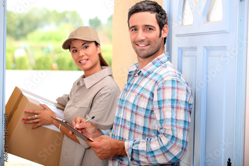 Photo: Woman delivering parcel Woman delivering parcel