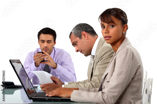 Photo: Three business colleagues having creative meeting Three business colleagues having creative meeting