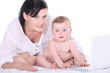 Mother with her baby and a laptop