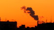 Sunset for smoking factory pipes