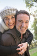 Affectionate couple taking a walk through park