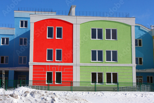 Photo: Modern colorful houses against a blue sky in the winter Modern colorful houses against a blue sky in the winter