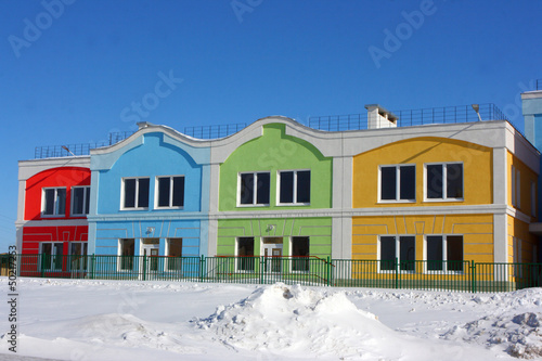 Photo: Modern colorful houses against a blue sky in the winter Modern colorful houses against a blue sky in the winter