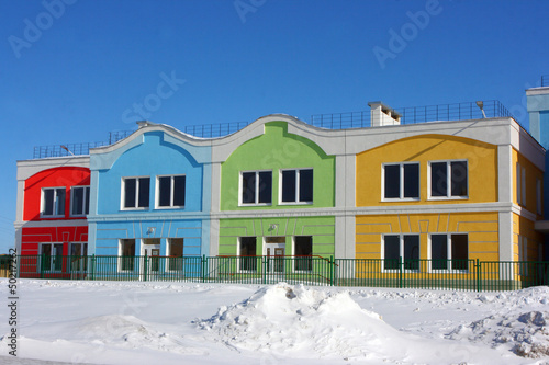 Photo: Modern colorful houses against a blue sky in the winter Modern colorful houses against a blue sky in the winter