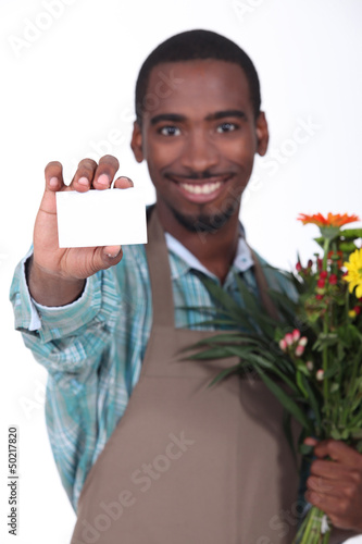 Photo: Male florist with business card Male florist with business card