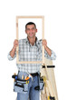 Carpenter showing wood frame