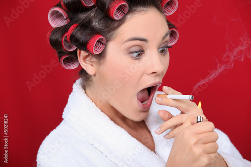 Photo: Woman with curlers and lit cigarette Woman with curlers and lit cigarette