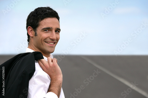 Photo: Businessman stood on empty road Businessman stood on empty road