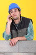 Photo: Laborer with cellphone Laborer with cellphone