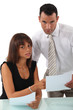 Business couple discussing paperwork