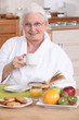 Senior woman having a relaxed breakfast