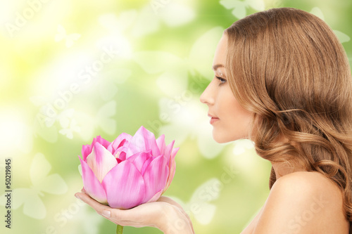 Photo: beautiful woman with lotus flower and butterflies beautiful woman with lotus flower and butterflies