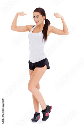 Photo: Woman showing her muscle Woman showing her muscle