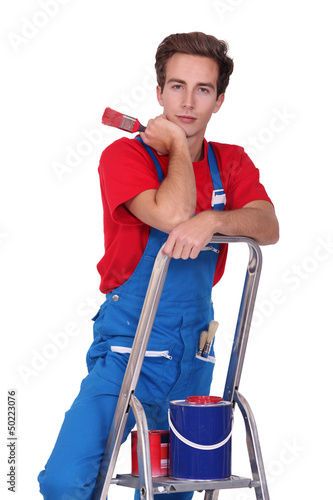 Photo: craftsman painter on a ladder craftsman painter on a ladder