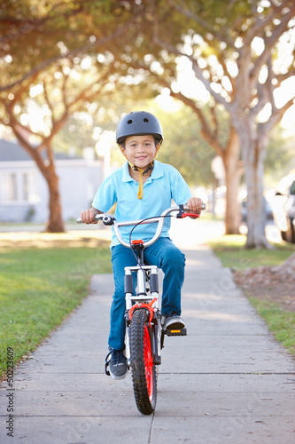 Photo: Boy Wearing Safety Helmet Riding Bike Boy Wearing Safety Helmet Riding Bike