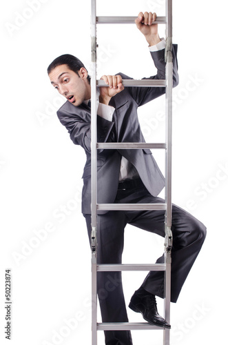 Photo: Businessman climbing the ladder isolated on white Businessman climbing the ladder isolated on white