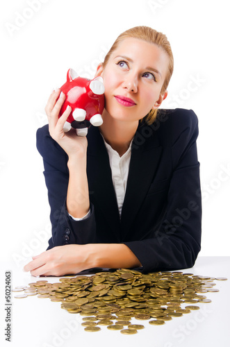 Photo: Woman breaking piggy bank for savings Woman breaking piggy bank for savings
