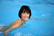 Brunette swimming in pool